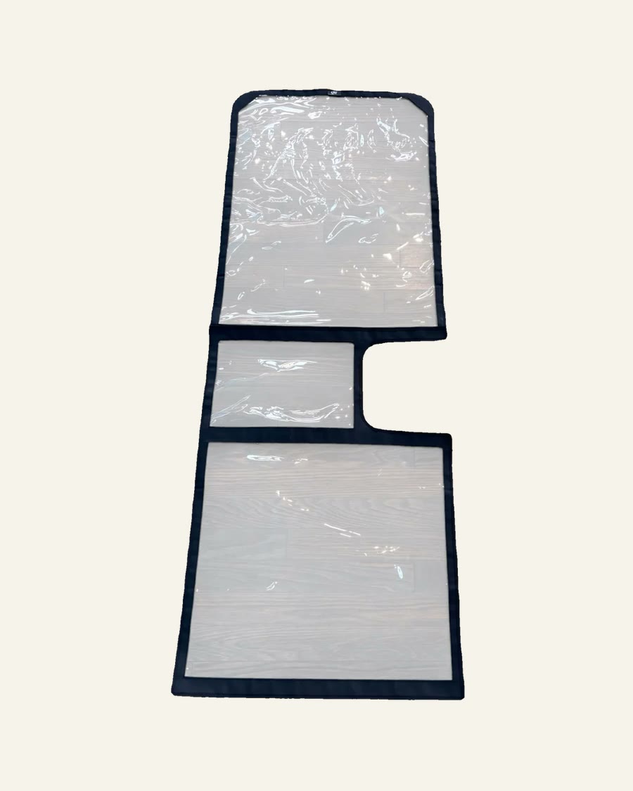 Clear View two-piece clear cover for an RV screen door, laid out with the top and bottom panels